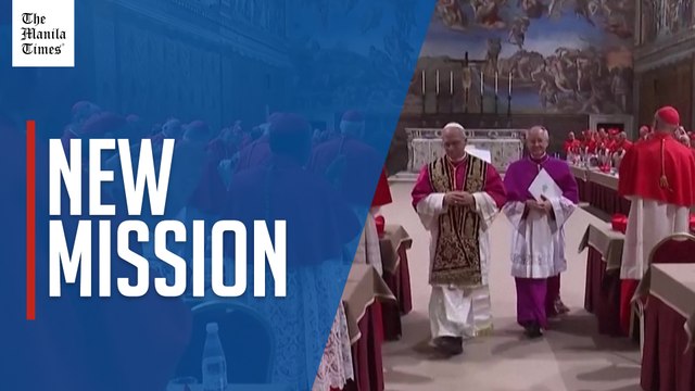 Pope Leo XIV prays after being elected