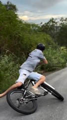 Epic Bicycle Fail: Rider Falls While Trying to Fix the Wheel!