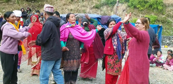 bride and groom dancing with family members in naumati baja |