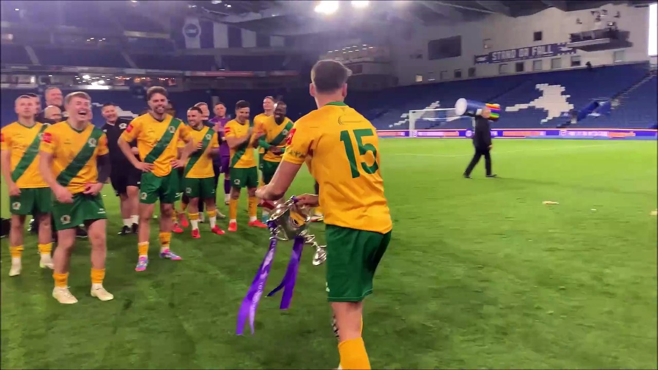 Horsham FC players and fans celebrate at the Amex Stadium after the Sussex Senior Cup is presented