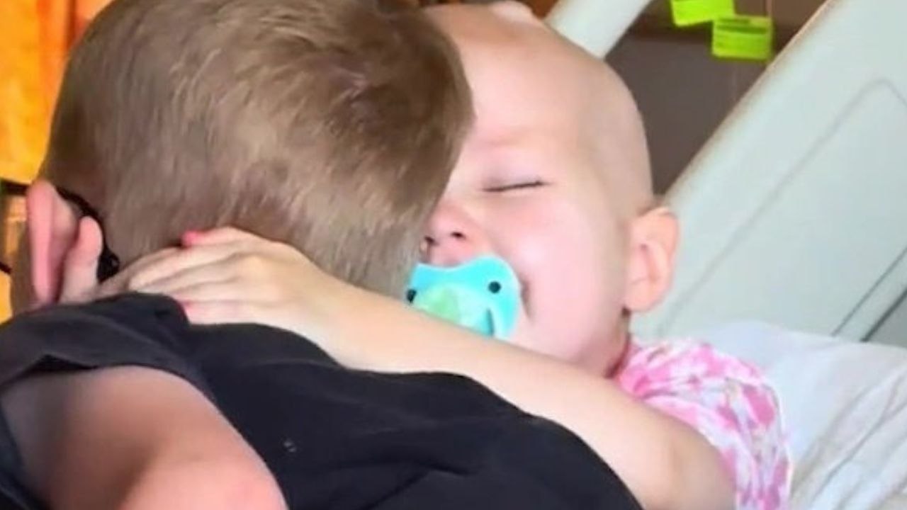 Heartwarming moment tot reunites with brother after 10 days in isolation