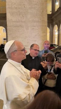 Pope Leo XIV gives greeting and blessing, hours after being elected