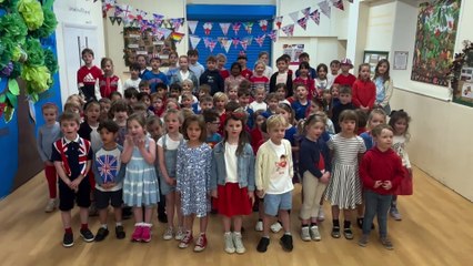 Children from St Mary's C of E Infant School, Frensham sing a VE Day song