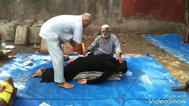 Indian street doctor treats with newspapers - street chiropractor _ yulichka wants it
