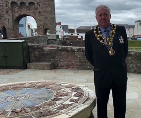 Mayor of Monmouth Councillor David Evans speaks on the damage caused to the millennium mosaic wheel in Monmouth