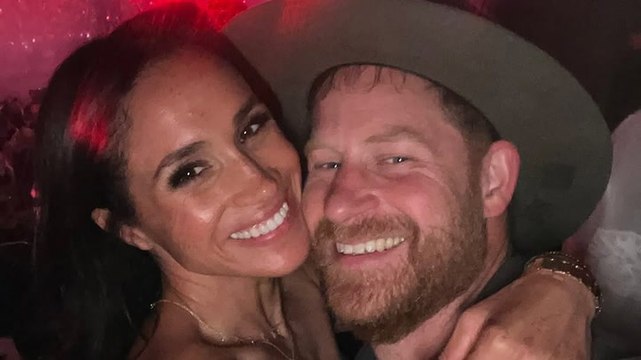Meghan Markle and Prince Harry embrace during date night at Beyonce concert