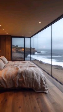 Oceanfront Serenity, Modern Luxury Bedroom with Floor-to-Ceiling Windows Overlooking Dramatic Coastal Waves and Rocky Shoreline Scenic View.#reel#reelinstagram#reelfacebook#fyp#foryou#cozychic#bedroomoasis#peacefulretreat#follow