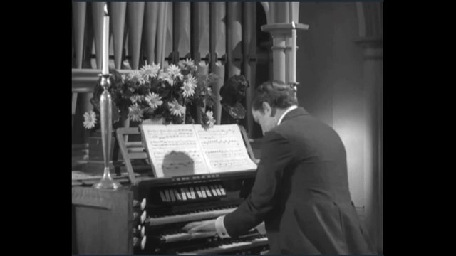 Dr. Jekyll at the organ playing late in the Fugue from Toccata and Fugue in D minor BWV 565