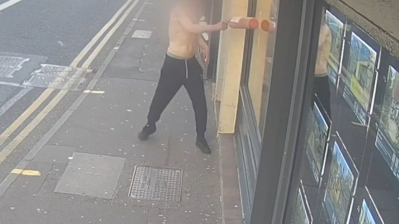 Topless yob on town centre rampage
