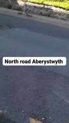 Car flipped upside down in two-vehicle collision in central Aberystwyth
