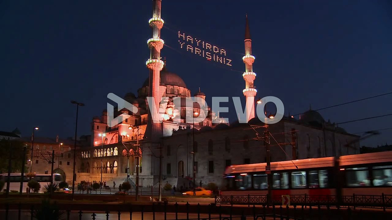 A tram passes in front of a mosque in istanbul Turkey at night 1