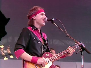 Dire Straits et Sting chantent "Money For Nothing" en live