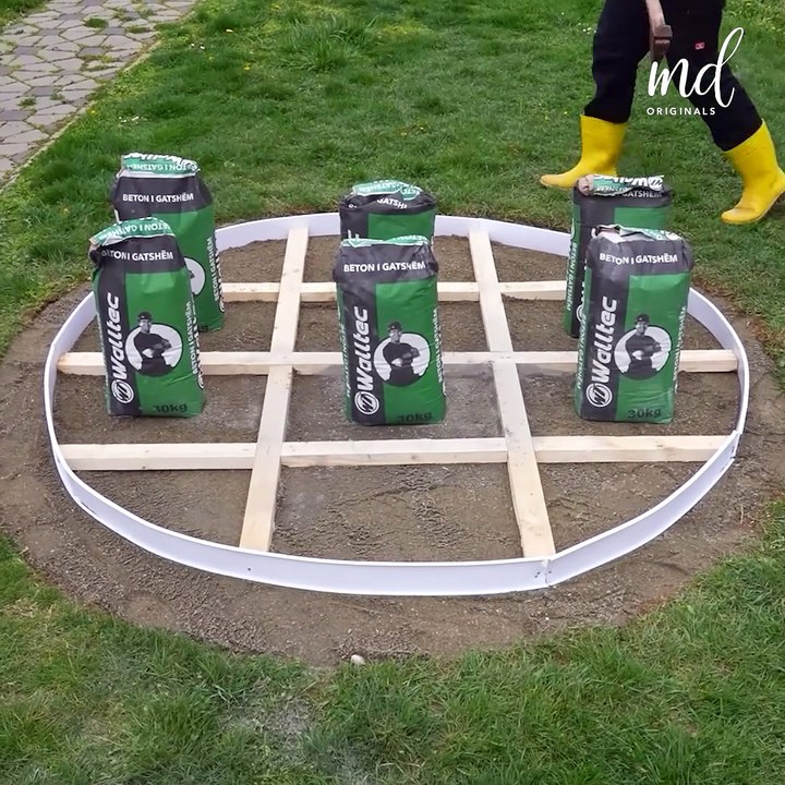 Creating a circular concrete patio through dry pour method