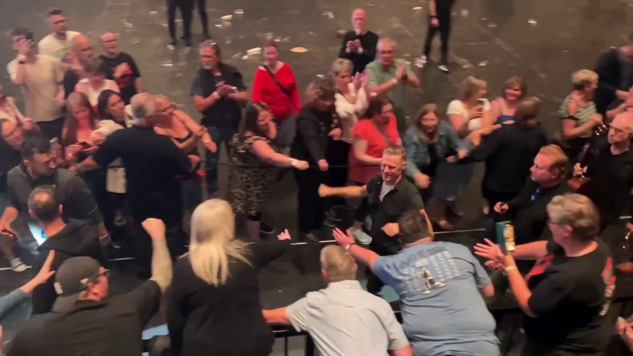Bryan Adams fist bumps fans after Roll With The Punches gig