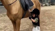 Kid riding horse.