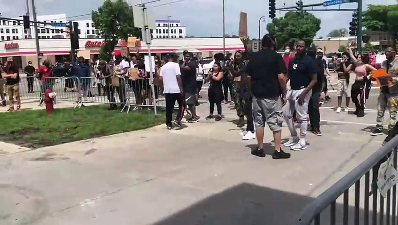 Two days after George Floyd was killed in Minneapolis, protesters at 38th and Chicago take out frustrations on police