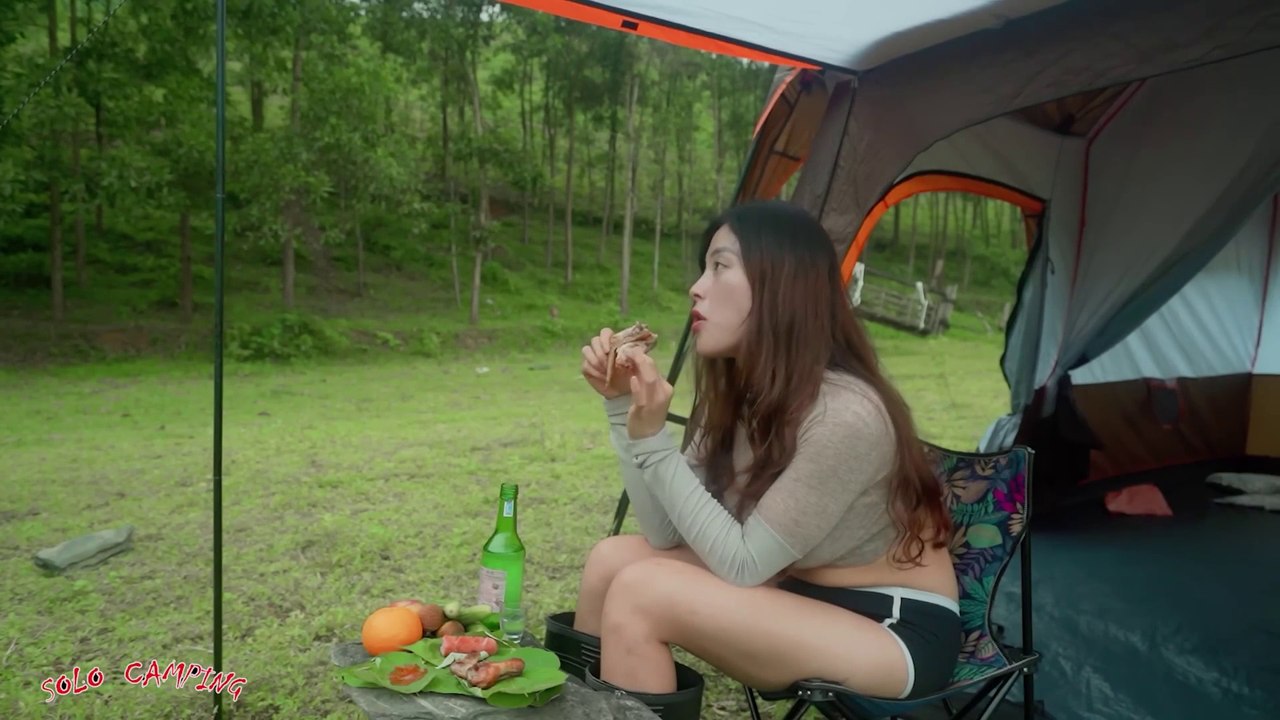 Camping deep in the forest relaxing with stunning mountain scenery on a sunny day