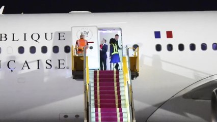 Slow-motion of moment French president Macron's face is pushed away in Vietnam