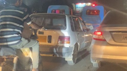 Goat and human sit together on a bike in perfect sync