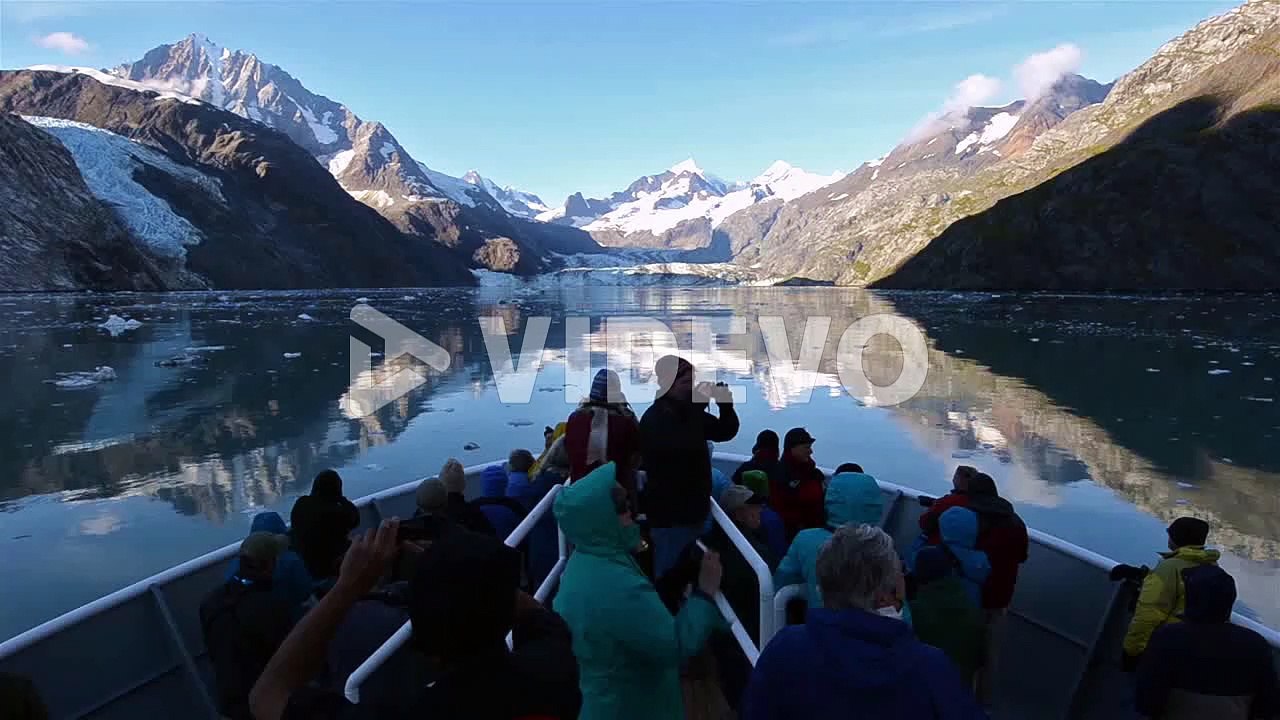 Tourists on the bow of a ship entering Johns Hopkins Inlet in Glacier Bay National Park Alaska1