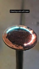Cleaning a coin with laser