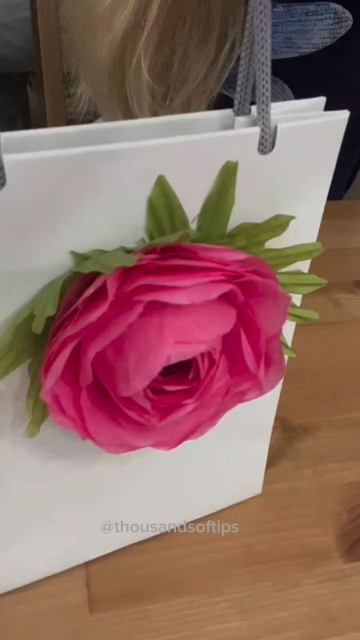 DIY Paper Flower for Gift Packaging via: @thousandsoftipsAdd a charming handmade touch to your gift wrapping with this easy DIY paper flower! Perfect for decorating presents, cards, or party favors.