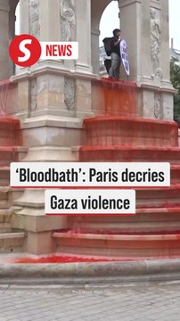 Human rights activists dye Paris fountain blood red for Gaza