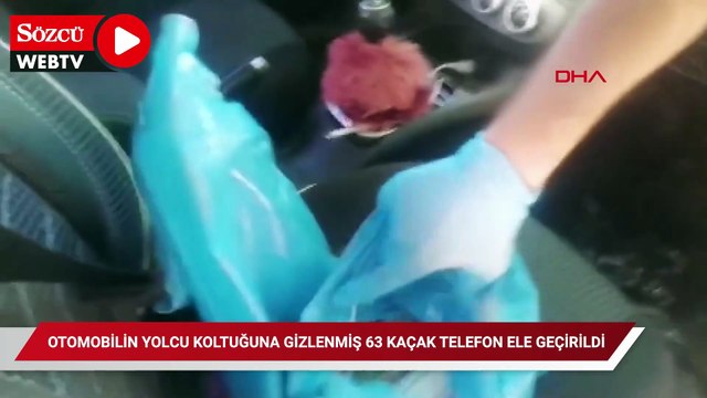 Otomobilin yolcu koltuğuna gizlenmiş 63 kaçak telefon ele geçirildi