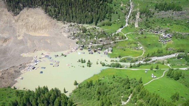 A scientific expert warns of climate change after a Swiss village is buried.