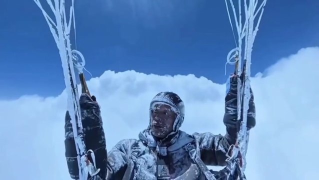 Paraglider accidentally soars above the clouds in death-defying icy flight caught on camera