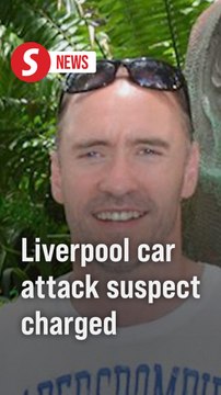 UK police charge man over Liverpool car collision that hurt dozens