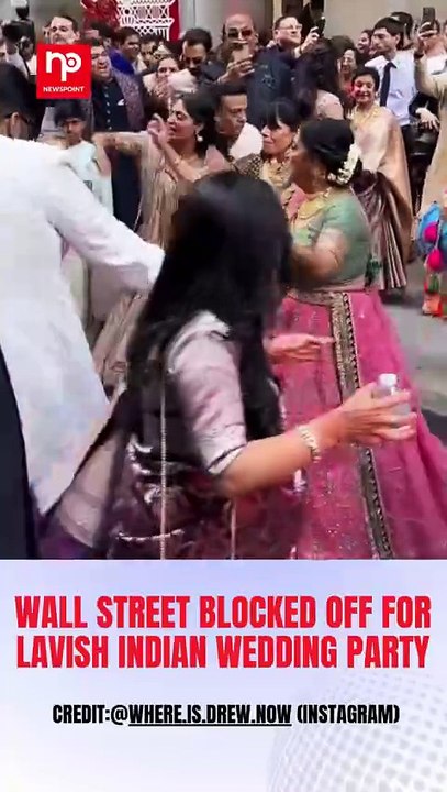 A grand Indian wedding procession brought a slice of desi celebration to New York’s iconic Wall Street, and the internet can’t get enough of it#wallstreet #indianba #wallstreet #blocked #lavish #indianwedding #party #wedding #Nabbharattimes #Newspoint (1)