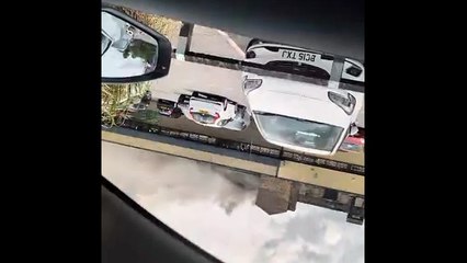 Black smoke billows from a fire at buildings behind Aldi in Todmorden Road, Rurnley, this afternoon