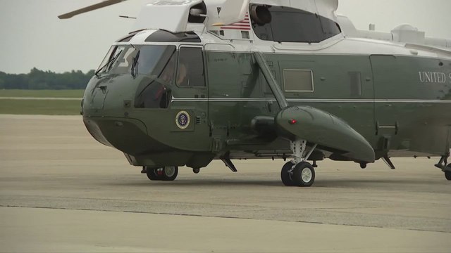 Trump's hair wildly spins before boarding Air Force One!