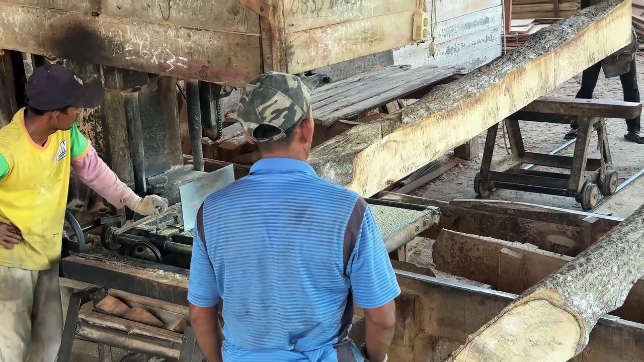 Processing 2x20 lumber with a sawmill machine for house construction