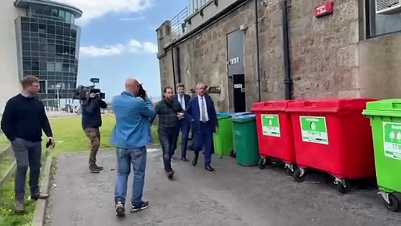 Reform leader Nigel Farage exits his Aberdeen press conference