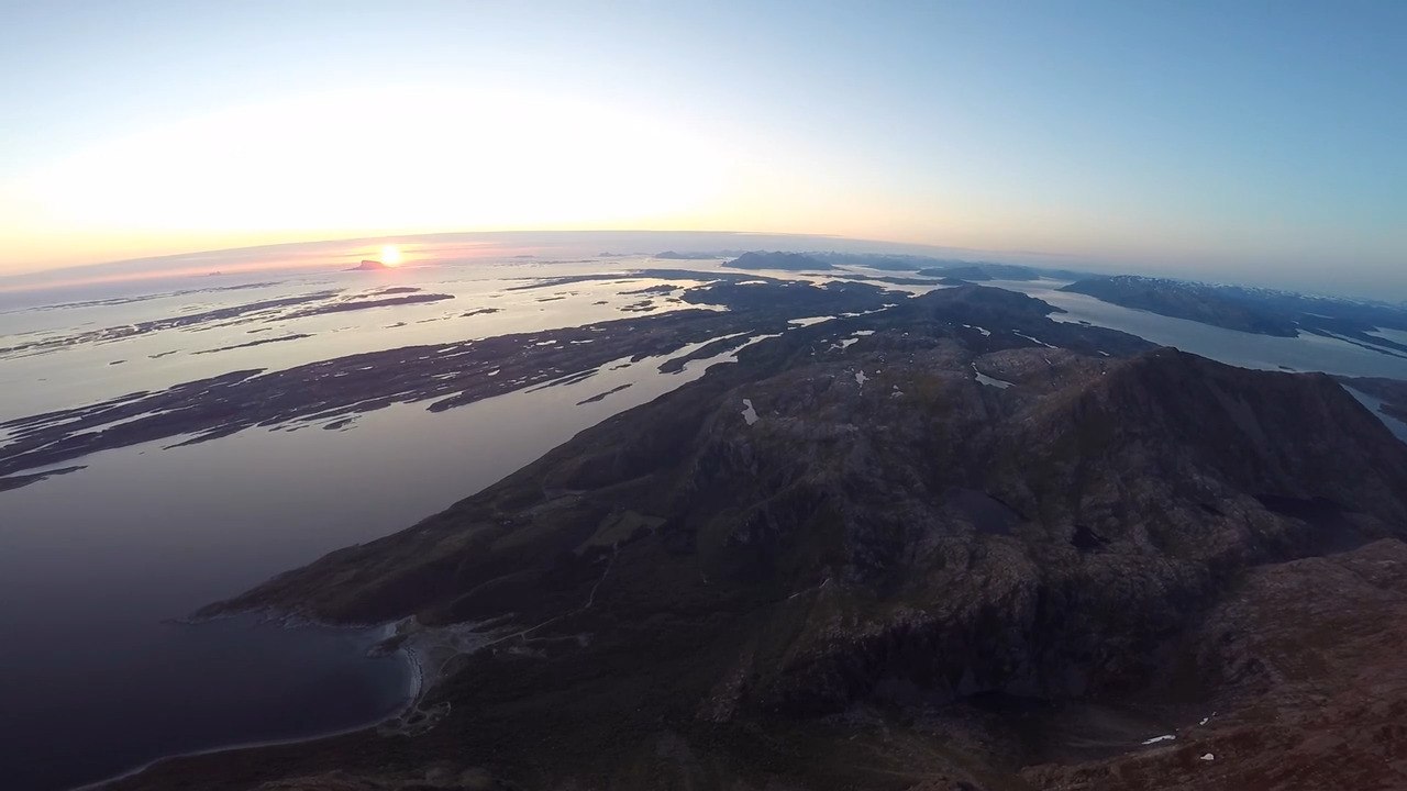 Amazing Drone View of Midnight Sun on Mountain Peak in Norway