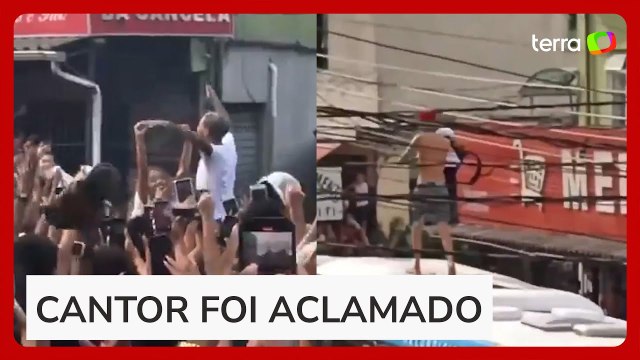 MC Poze do Rodo é festejado por multidão ao sair da cadeia; Oruam sobe em ônibus para celebrar