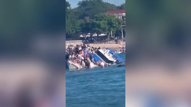 Watch: Terrified passengers cling on as boat carrying 89 tourists sinks in Bali
