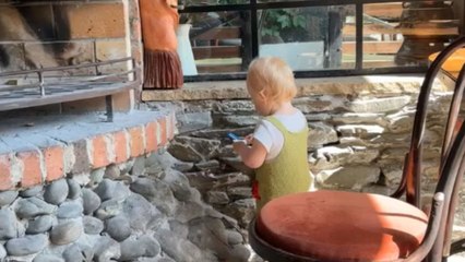 Toddler slowly rotates her neck to check if anyone is watching her mischief