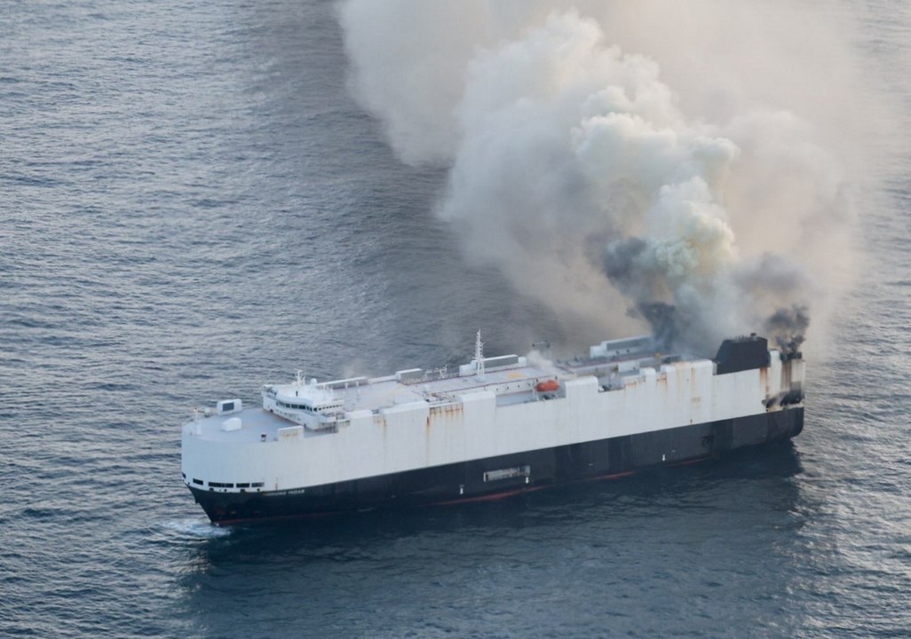 A British-flagged cargo ship carrying thousands of cars has caught fire