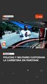 Policías y militares custodian la carretera en Parotani