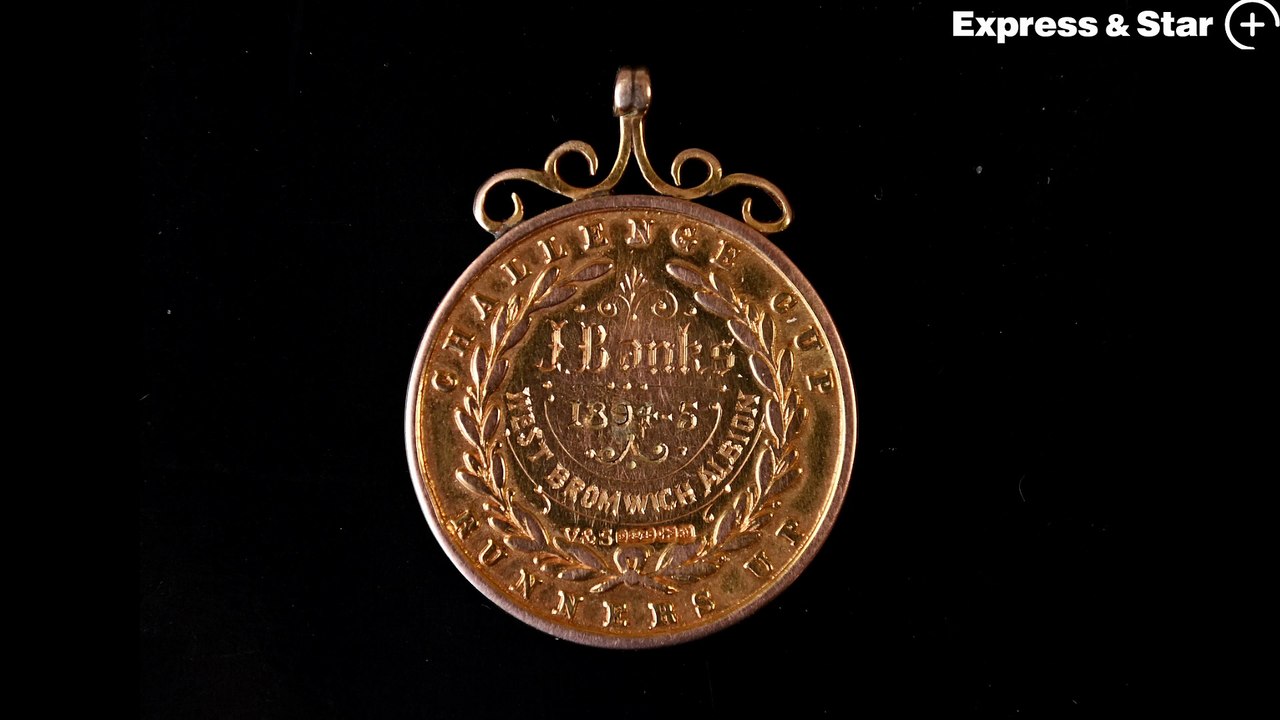 Mark Hannam from Fieldings Auctioneers with a rare football medal dating 1894/95