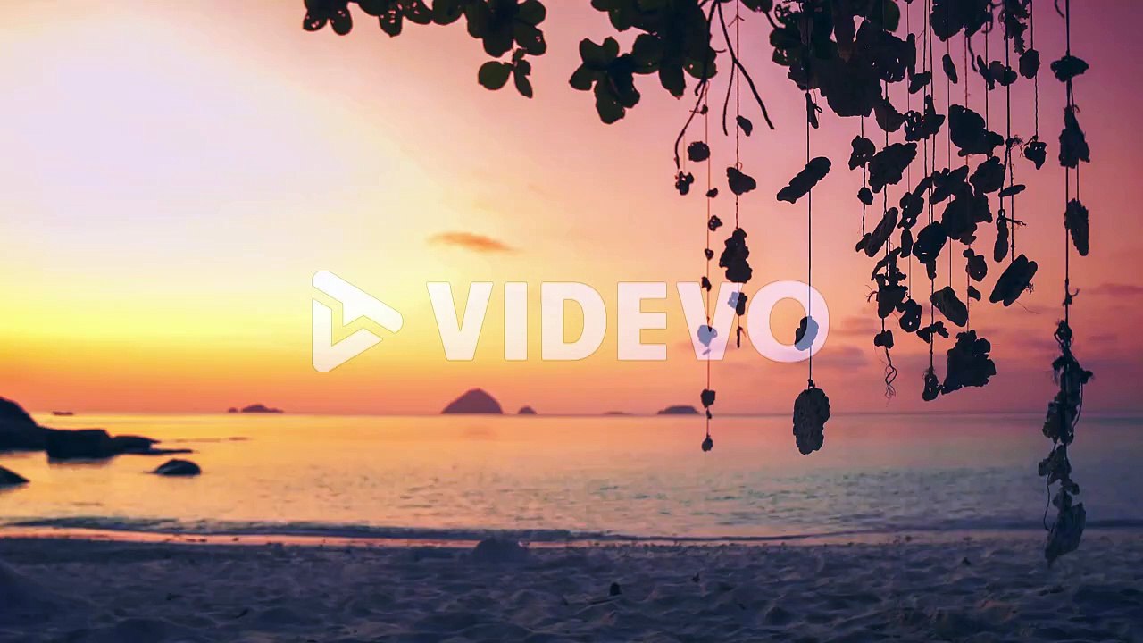 4K UHD Cinemagraph of a mobile gently swinging in the wind at a beach on Perhentian Island, Malaysia by sunset