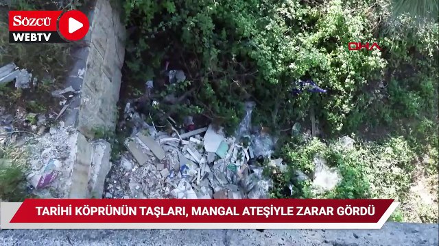 Tarihi köprünün taşları, mangal ateşiyle zarar gördü
