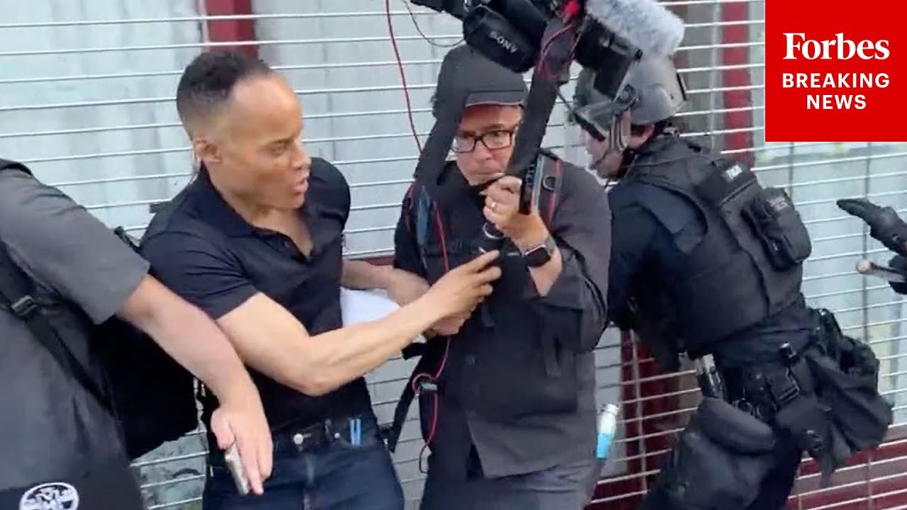 LAPD Officers Rush Into CNN Crew During Anti-IC...