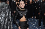 Miley Cyrus only wears 'very modest bathing suits' because she's haunted by Internet trolling over her raunchy outfits
