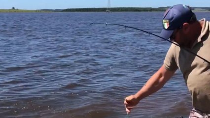 Fish refuses to surrender after being caught & forces fisherman into unexpected action