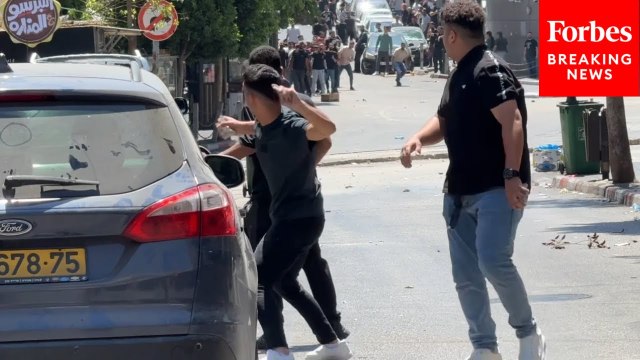 Palestinians Throw Rocks At Israeli Forces As They Raid Ramallah In The Occupied West Bank