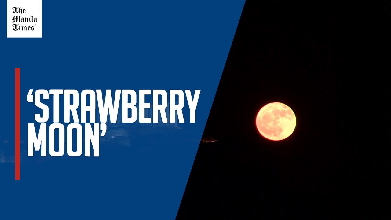 'Strawberry Moon' rises behind ancient Greek temple